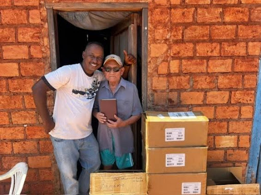 Legacy Guyana Man with bibles